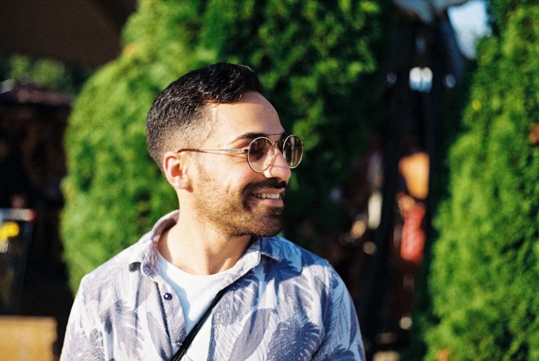 Man with beard and glasses smiling