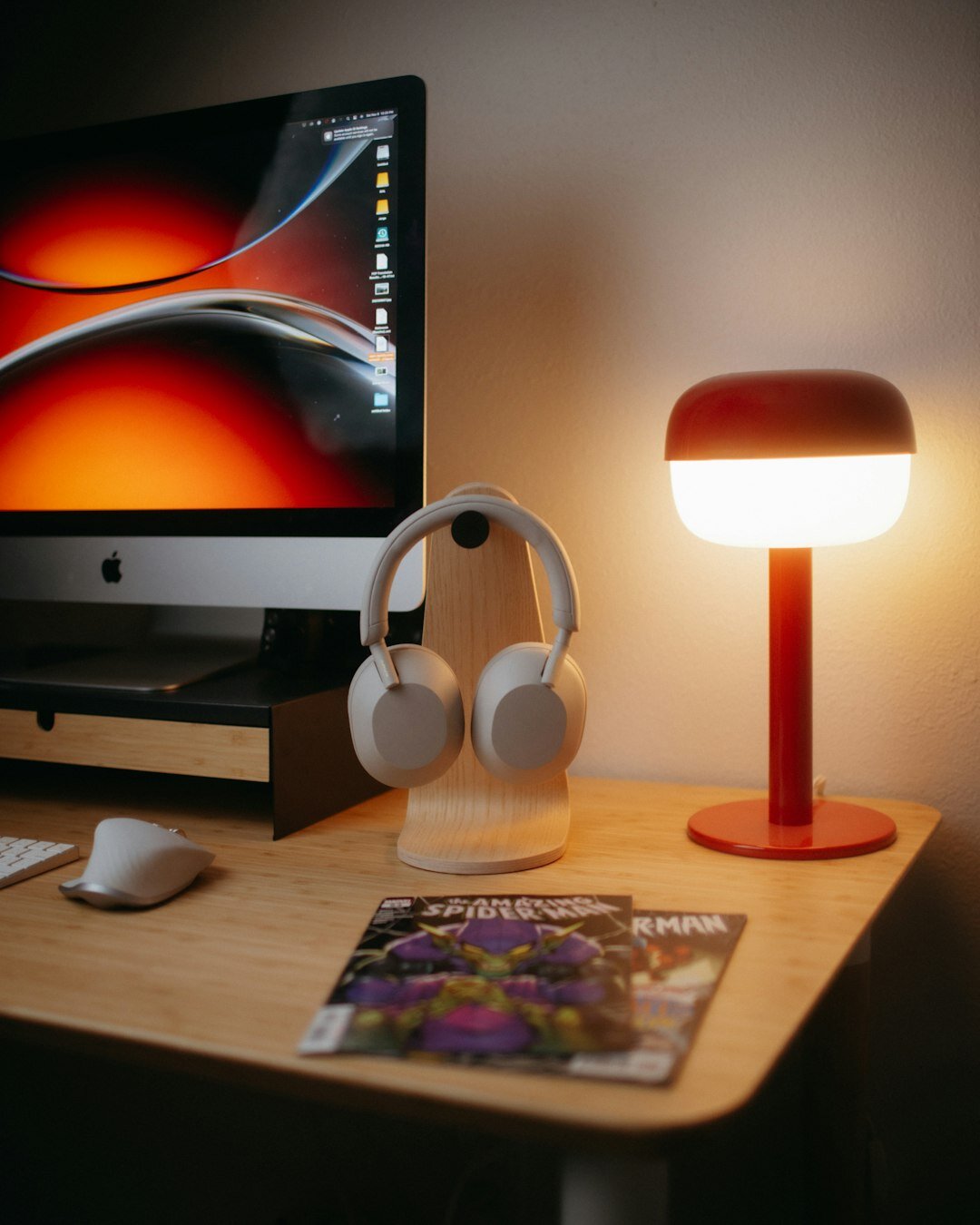 Laptop and notebook on a wooden desk